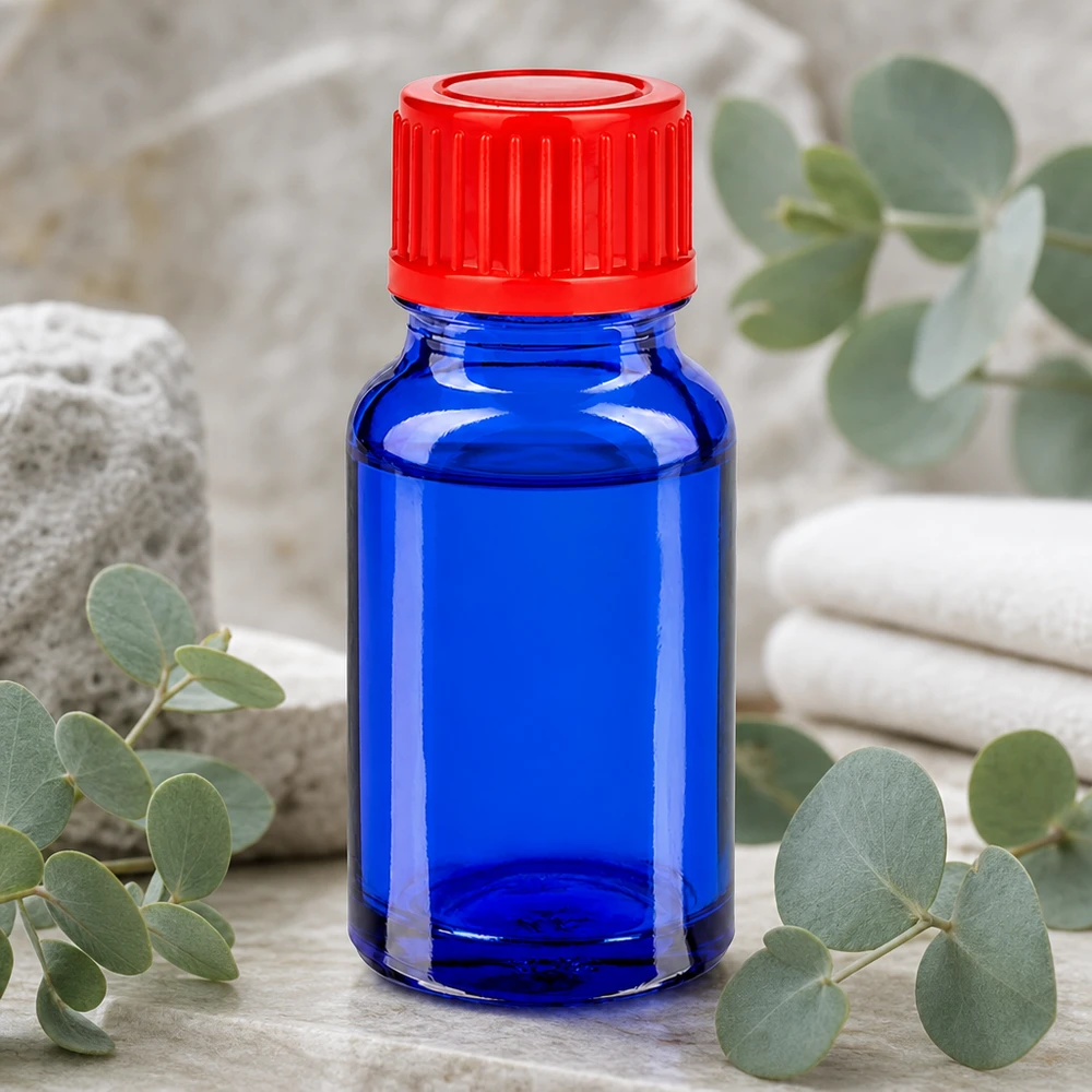 Kompakti 10 ml:n laboratoriopullo sinisestä lasista, jossa on ergonominen kierrekorkki tarkkaa annostelua varten.