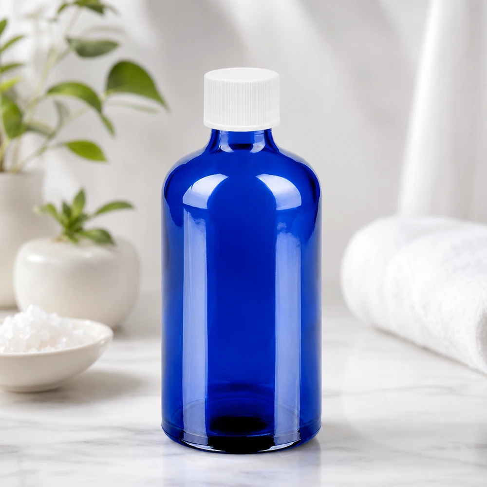 Kompakti 100ml lasipullo kirkkaan sinisellä ja valkoisella 11mm korkilla jokapäiväiseen käyttöön.