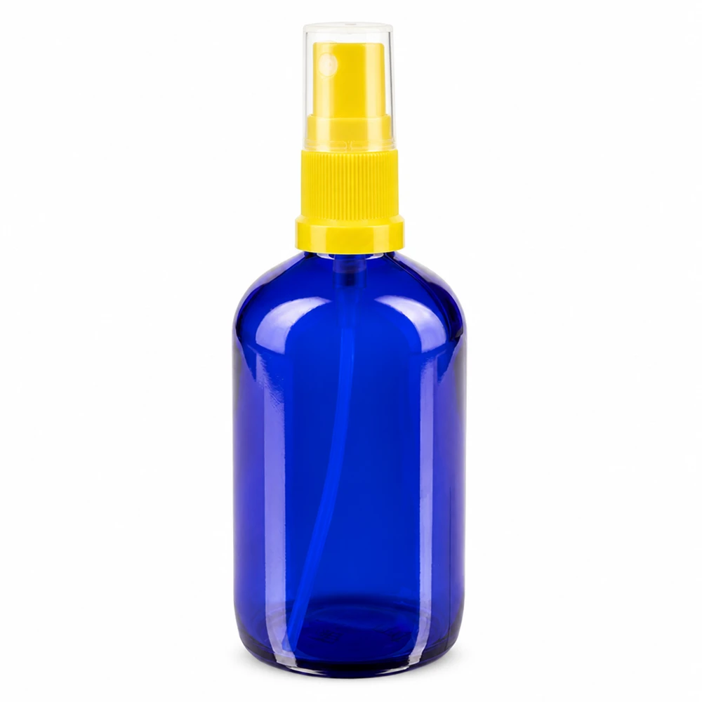 100 ml:n sininen lasisuihkepullo, jossa on keltainen sumutin, apteekkilasista, vakiolaatuinen
