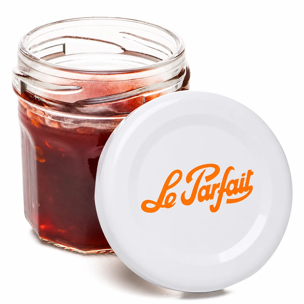 Le Parfait minipurkki 44ml avattu täynnä punaista hilloa ja oranssi logo valkoisessa kannessa.