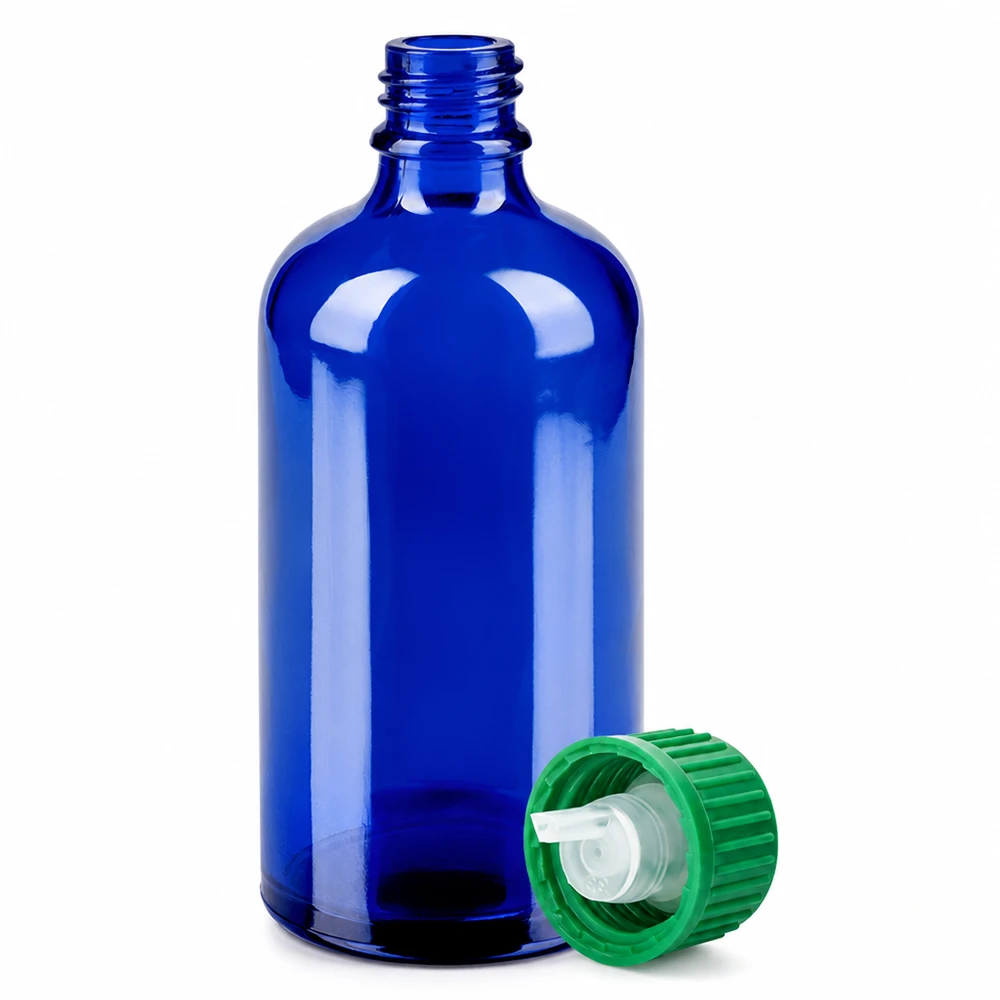 100ml sininen lasipullo, jossa vihreä kierrekorkki ja tiputin aromaterapiaan ja kosmetiikkaan.