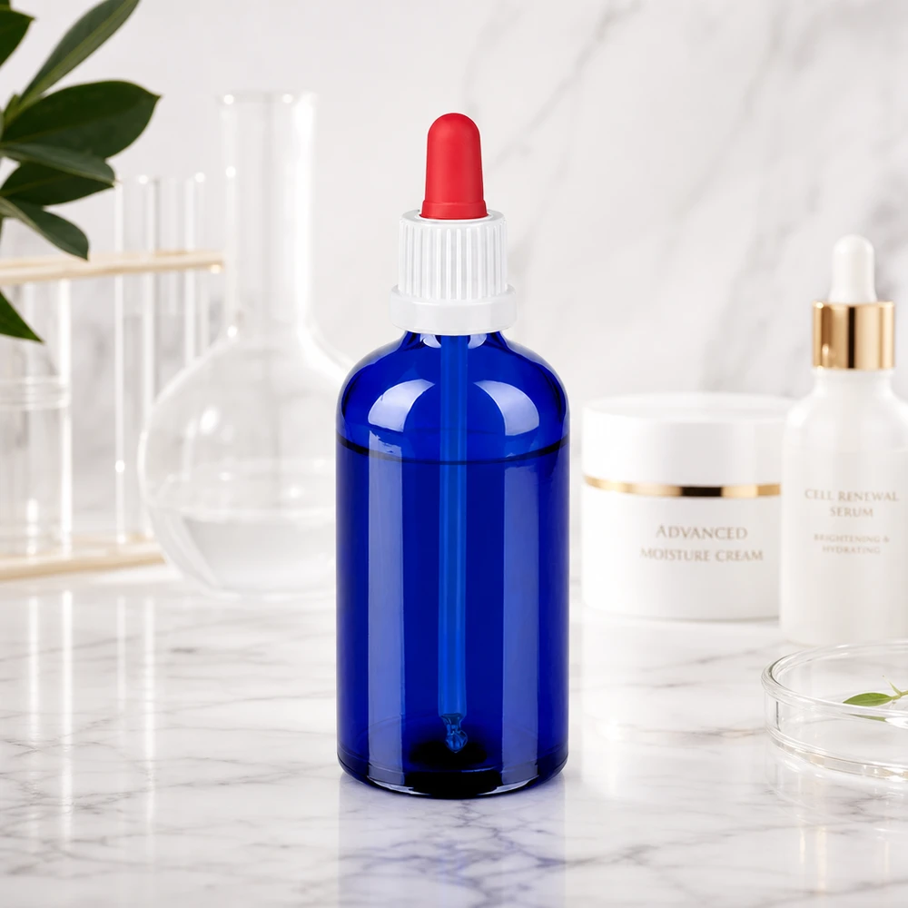 Kompakti 100ml tippapullo, joka on valmistettu kestävästä sinisestä lasista nesteiden turvalliseen säilytykseen.