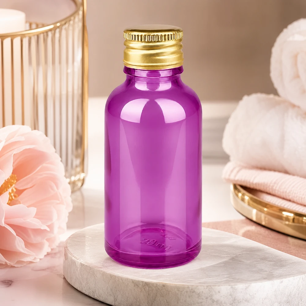 30ml violetti lasipullo, jossa on kultainen kierrekorkki, ihanteellinen valoherkille aineille ja seerumeille.