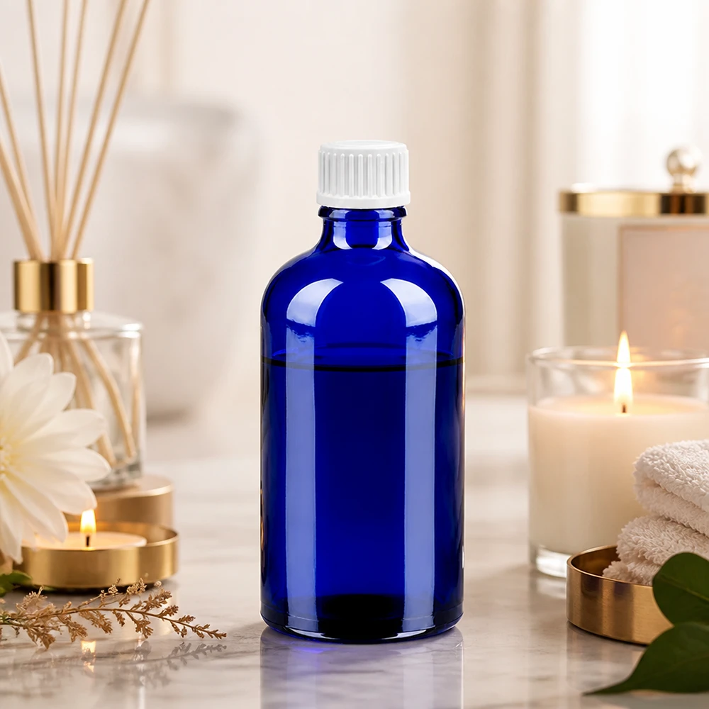 Tyylikäs sininen lasipullo 100ml valkoisella tiputuskorkilla aromaterapiaa ja eteerisiä öljyjä varten.