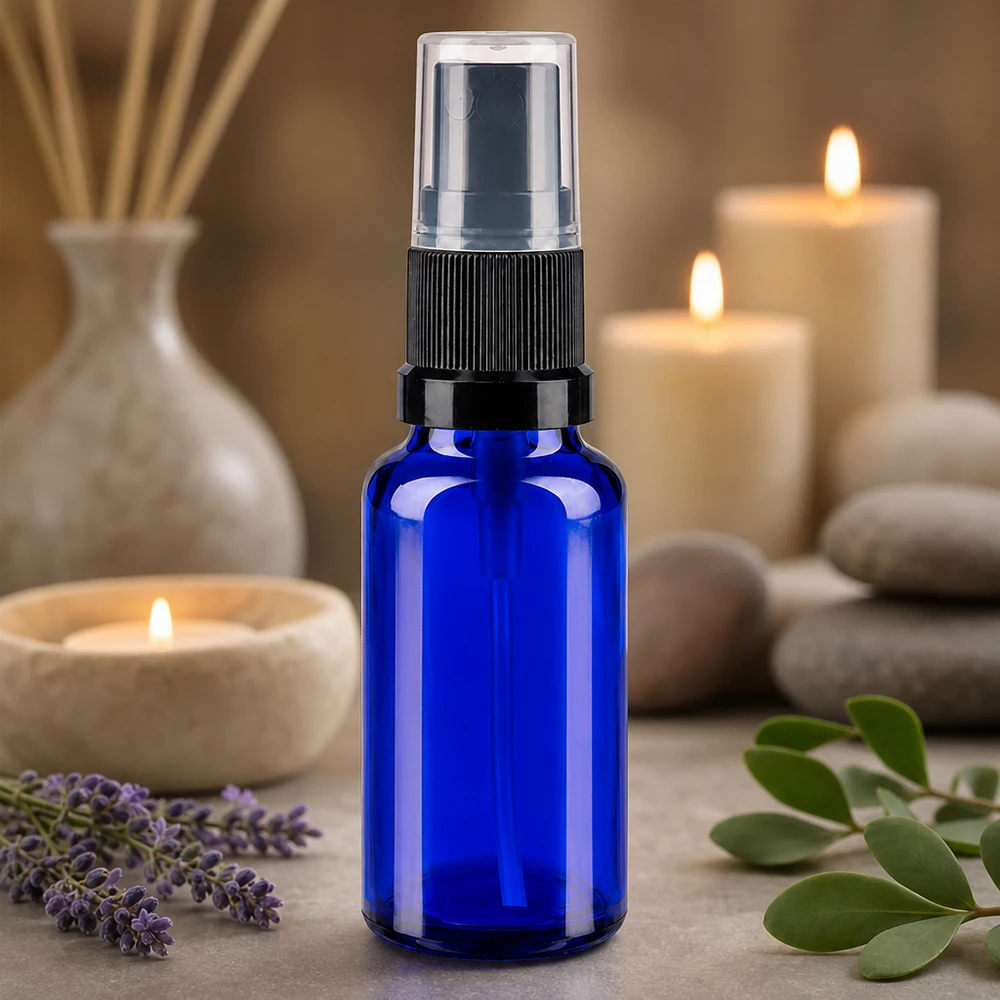Sininen 20 ml:n lasipullo, jossa on hienosumutin, aromaterapiaan: laventeli ja eteeriset öljyt