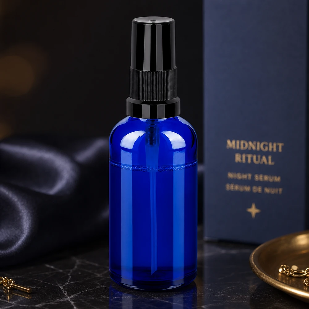 Premium 50ml lasinen suihkepullo koboltinsininen, jossa on ammattimainen suihkejärjestelmä ihonhoitoon.