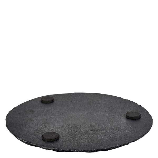 Liuskekivinen tarjoilulautanen pyöreä Ø150mm Liuskekivilevy pyöreä 15cm, jossa on kolme mustaa kumijalkaa liukastumista estävää jalustaa varten valkoisella pohjalla.