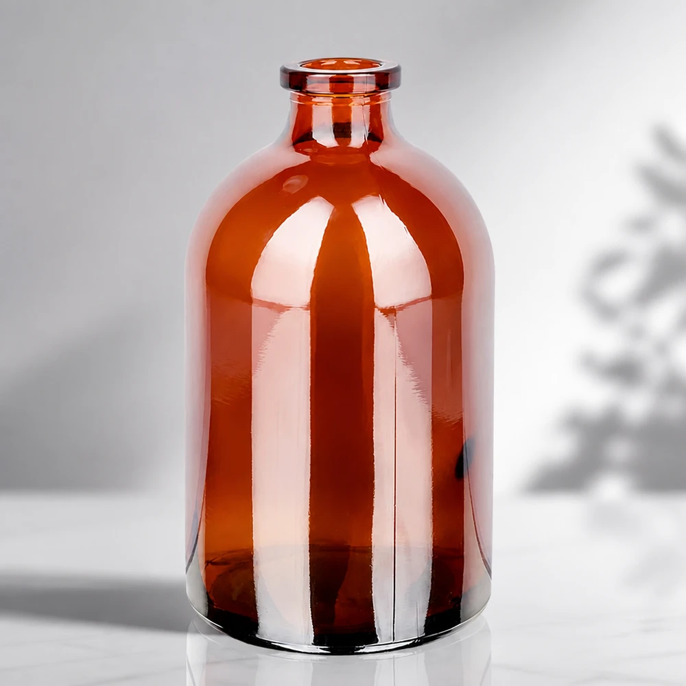 Injektiopullo meripihkalasista 100ml Sterile Glasflasche 100ml in Bernsteinfarbe mit charakteristischer Apothekerflasche-Silhouette