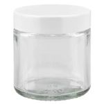 Läpinäkyvät lasipurkit valkoisella kannella