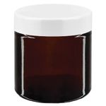 Ruskeat lasipurkit valkoisella kannella