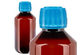 Ruskeat PET-lääkepullot sinisellä korkilla