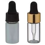 Pienet kierrekorkilliset pullot pipeteillä