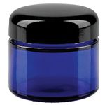 Siniset lasipurkit mustalla kannella