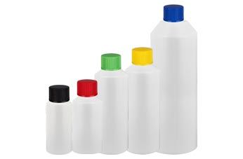 Valkoiset sylinterimäiset pullot korkilla